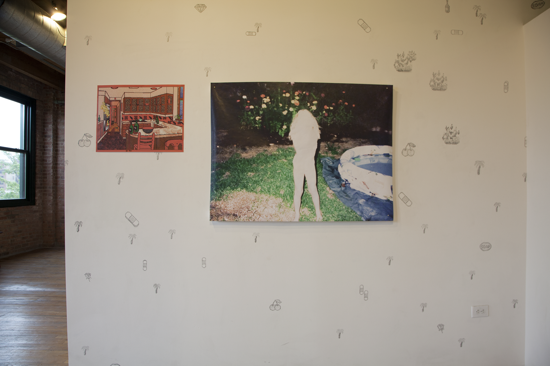 Detail shot of a print showing an overexposed white figure of a young girl in front of a rose bush and kiddie pool